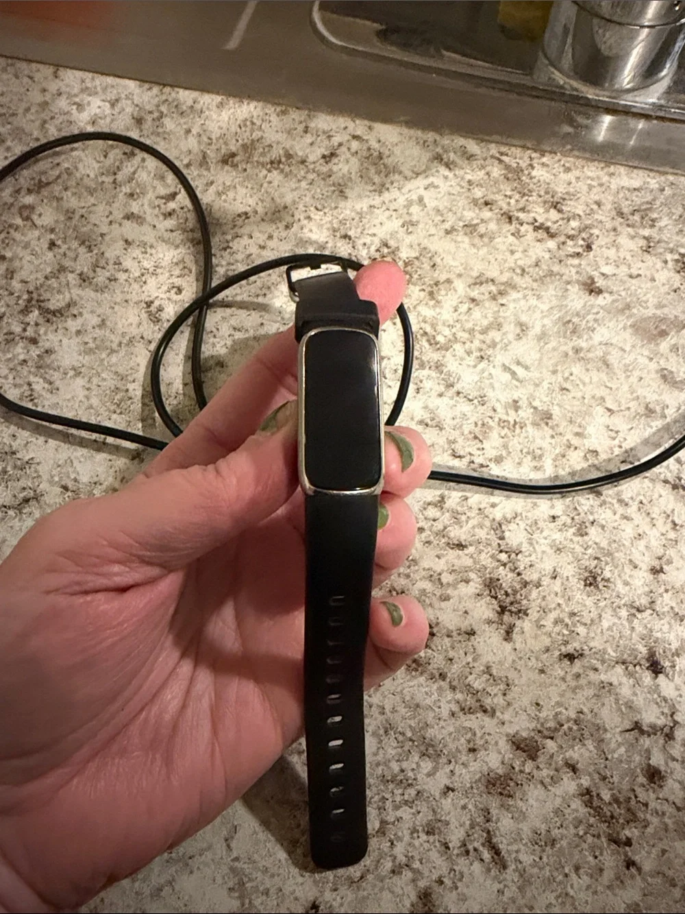 Sleek Black Fitbit Luxe Fitness Tracker with Silver Trim